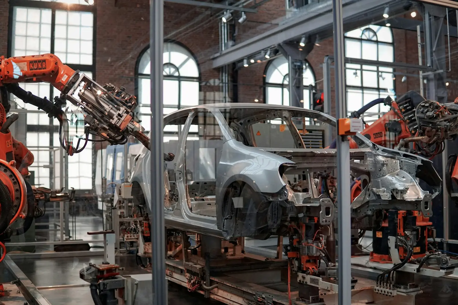 Industrial robotic arms working along an automated production line
