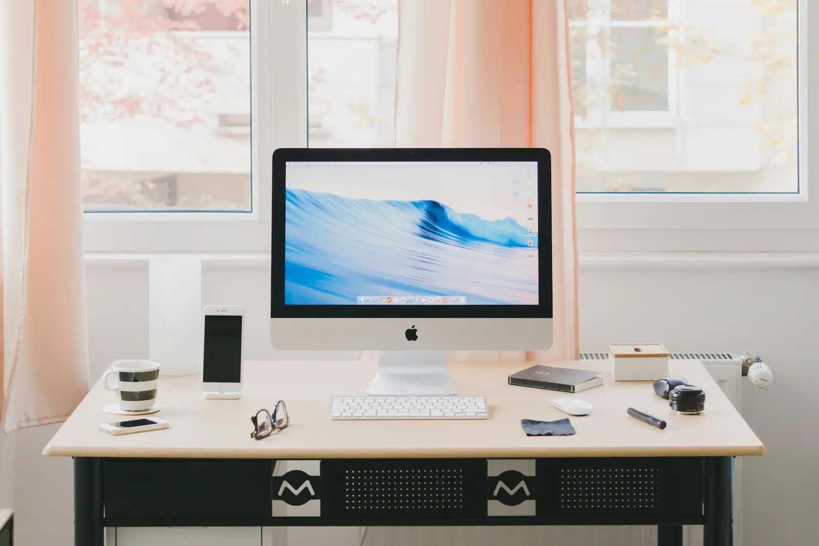 Desktop computer displaying a web interface in a studio workspace